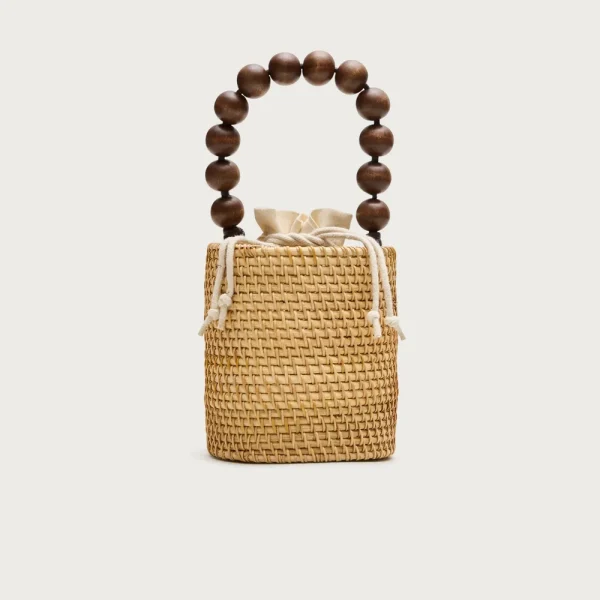 Handknotted rattan bucket bag with wood beads
